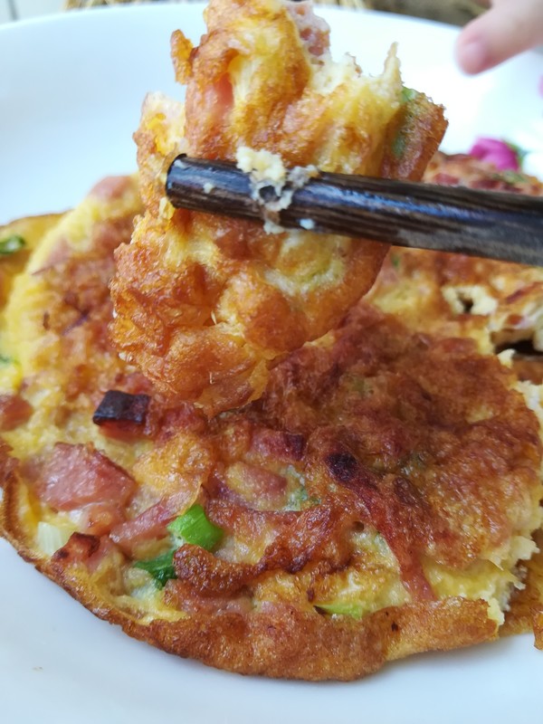 火腿粒煎蛋餅的做法-家常味煎菜譜-易網健康養生網 火腿粒煎蛋餅的做法-家常味煎菜譜