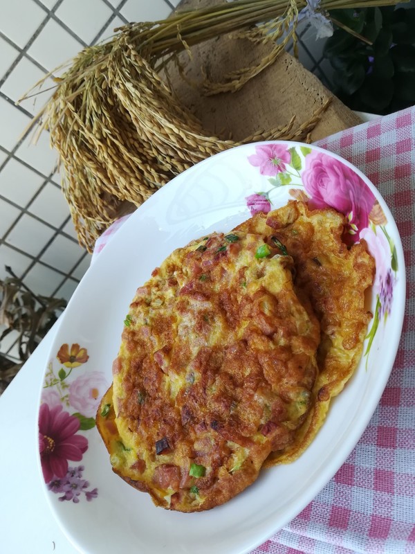 火腿粒煎蛋餅的做法-家常味煎菜譜-易網健康養生網 火腿粒煎蛋餅的做法-家常味煎菜譜