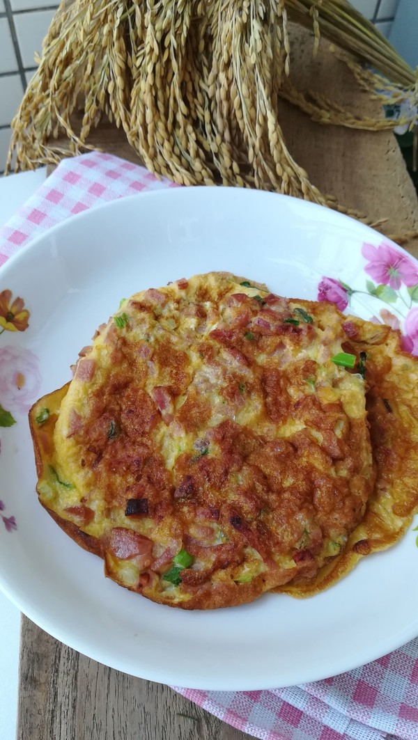 火腿粒煎蛋餅的做法-家常味煎菜譜-易網健康養生網 火腿粒煎蛋餅的做法-家常味煎菜譜
